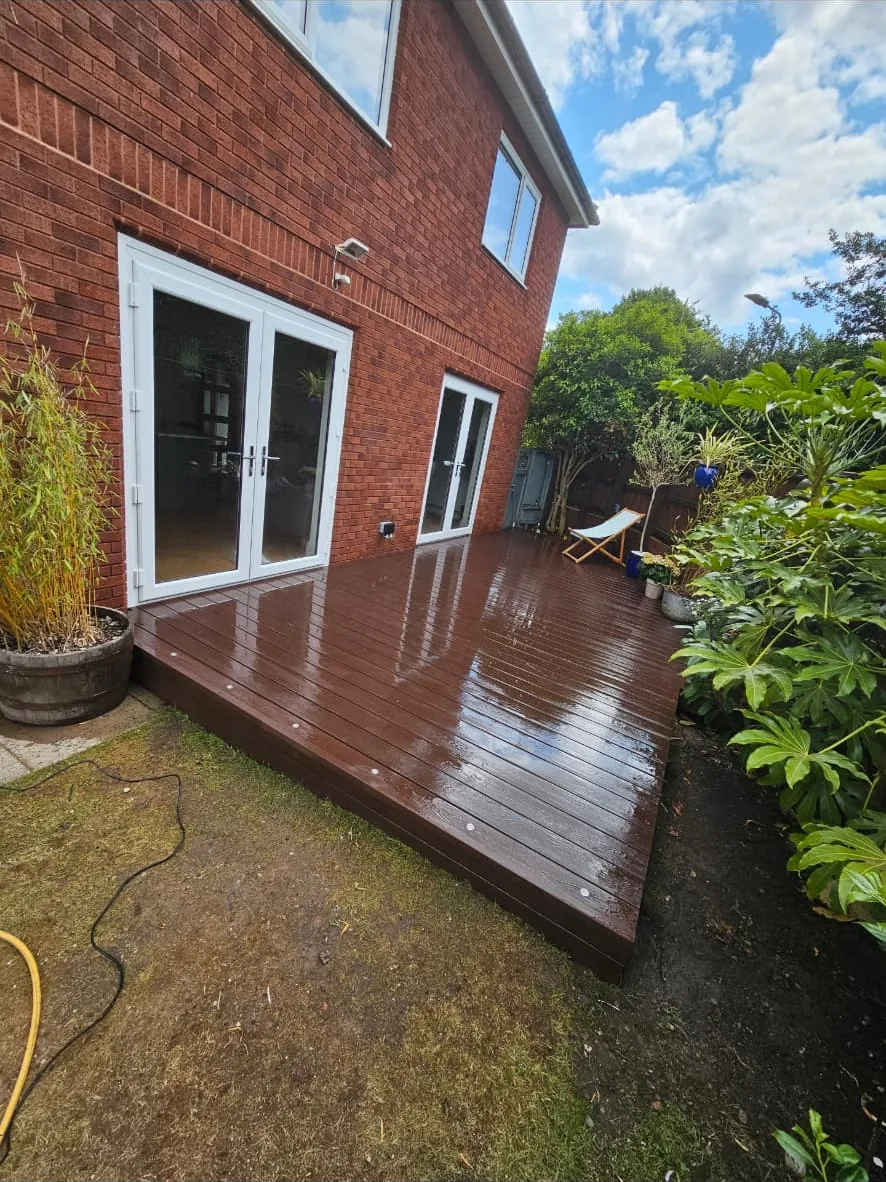 Finished deck running out from the French doors with inset lights along the fascia edge